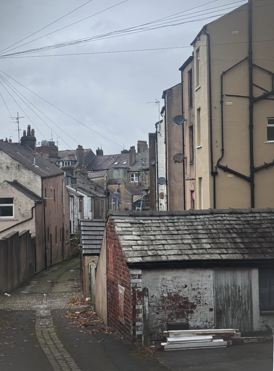 An alley in Morecambe with ramshackle stone houses