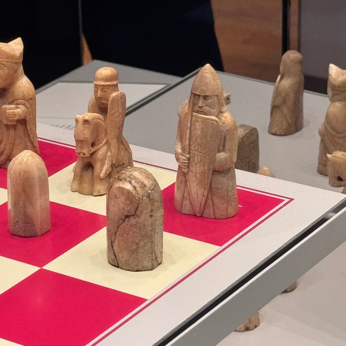 Various Lewis Chessmen on a board