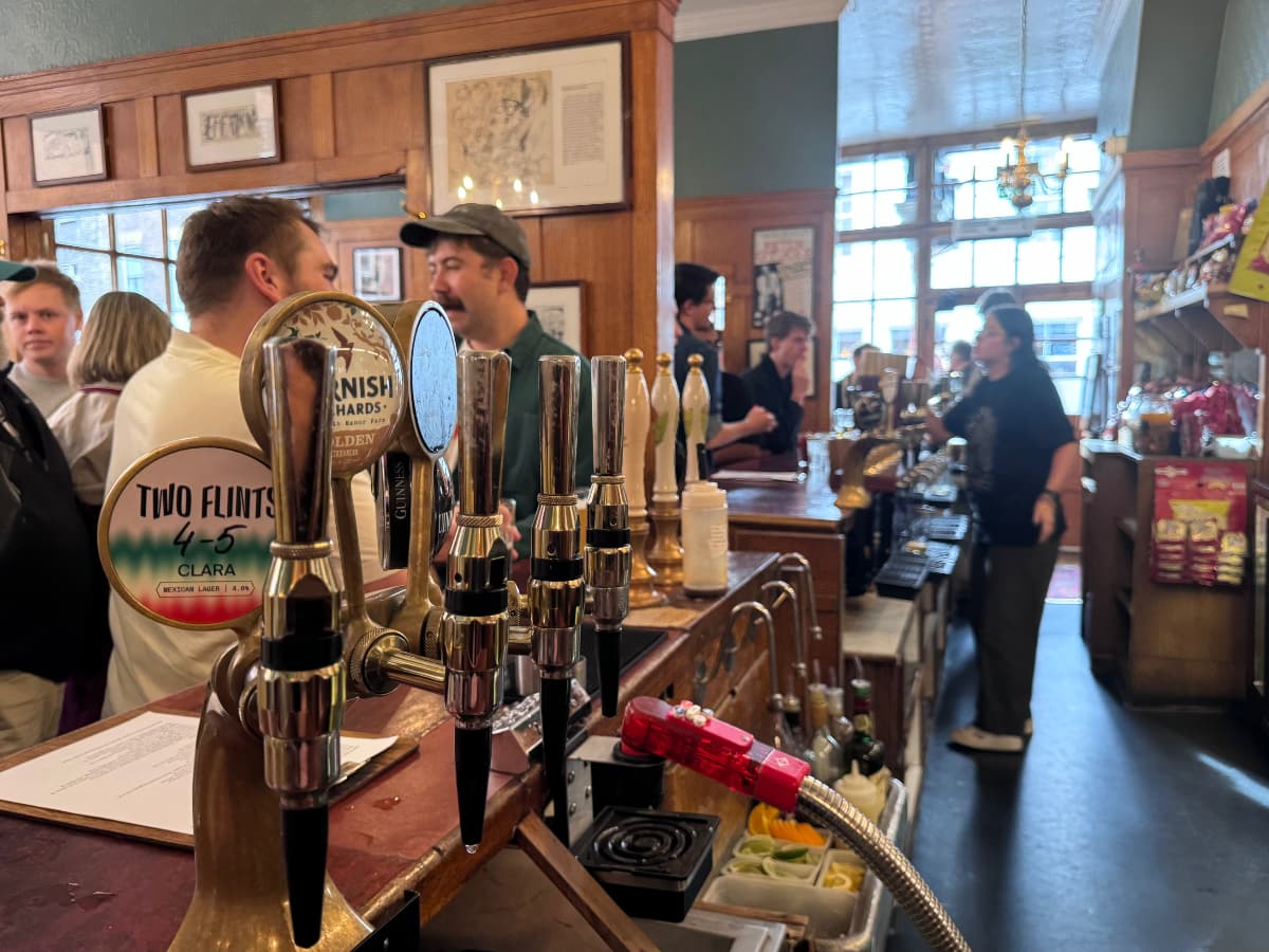 A crowded bar scene at the Coach and Horses