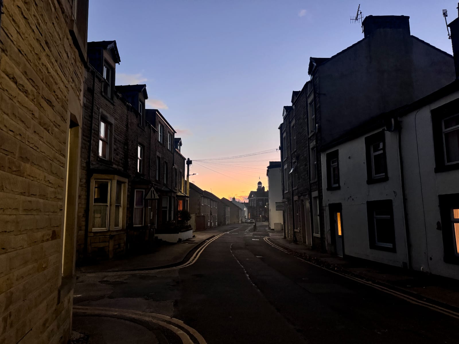 A narrow street in Poulton at dusk