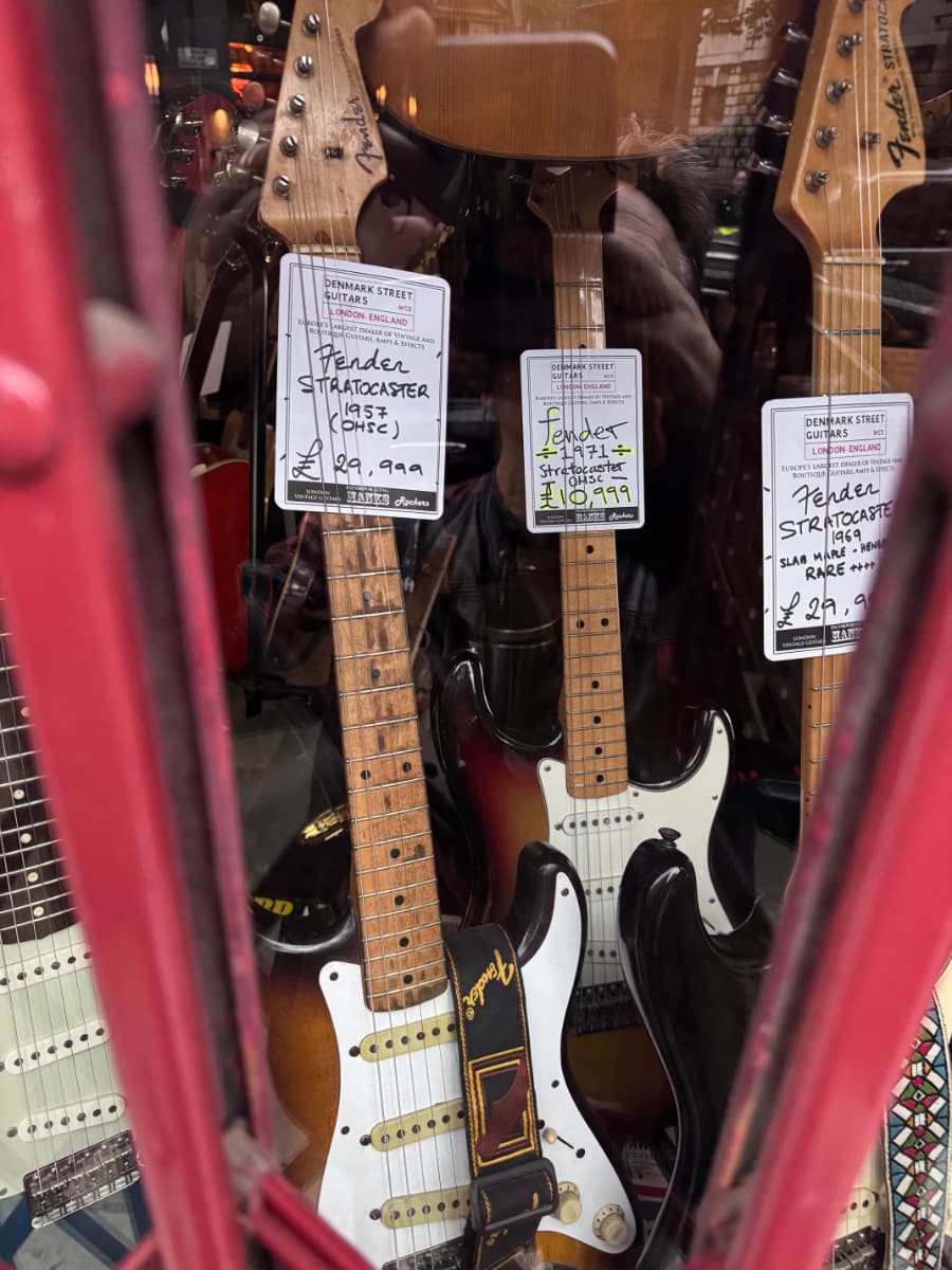 Vintage Fender Stratocasters, including a 1971 going for £10,999, and a 1957 for £29,999