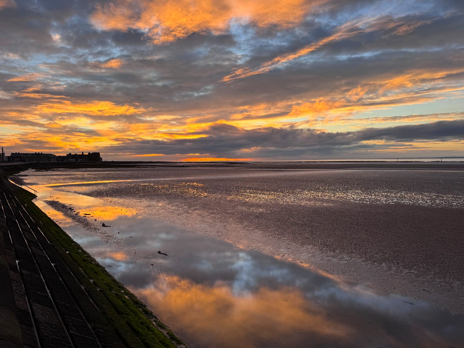 Stunning sunset over Morecambe Bay at low tide