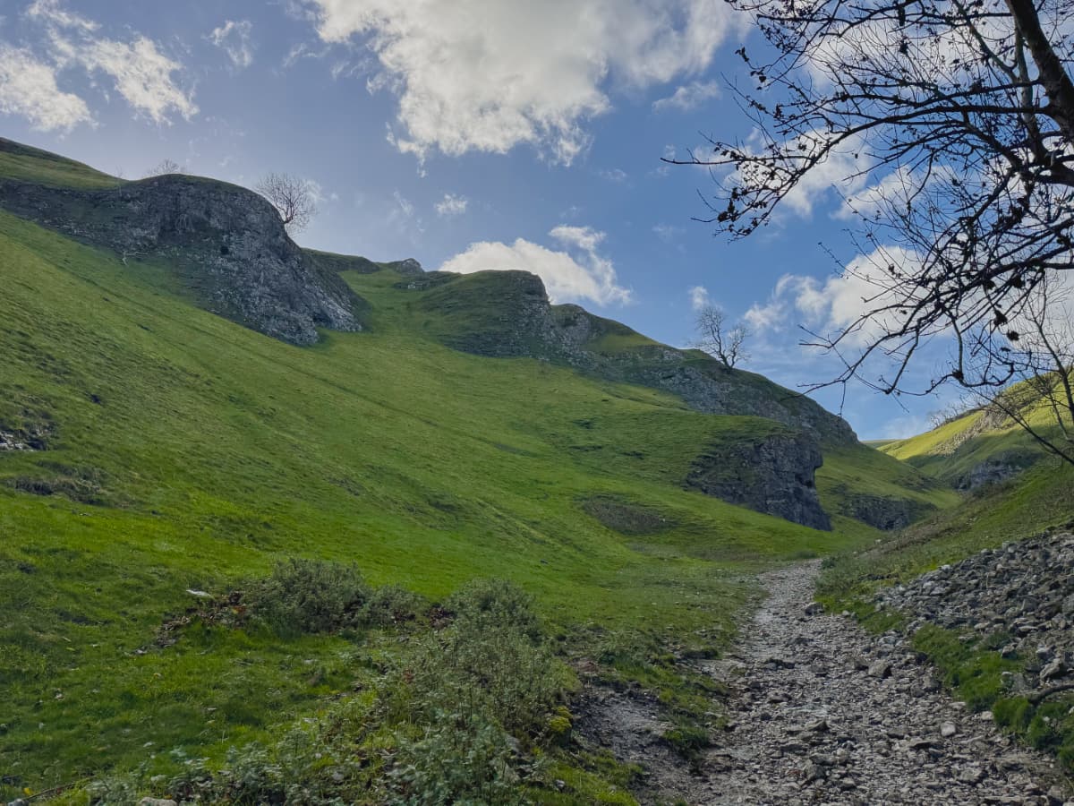 The rocky green slopes of Cave Vale