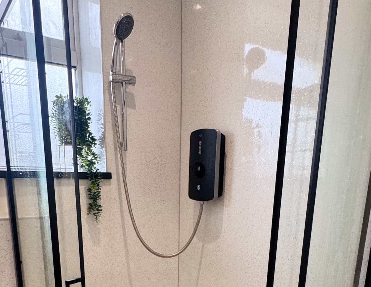 A recently renovated shower in Morecambe UK, featuring a heat-on-demand unit